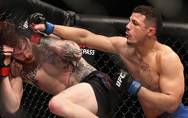 <a href='../fighter/drakkar-klose'>Drakkar Klose</a> (R) throws a right on <a href='../fighter/devin-powell'>Devin Powell</a> during the <a href='../event/UFC-Silva-vs-Irvin'>UFC Fight Night </a>event at the at Talking Stick Resort Arena on January 15, 2017 in Phoenix, AZ. (Photo by Christian Petersen/Getty Images)