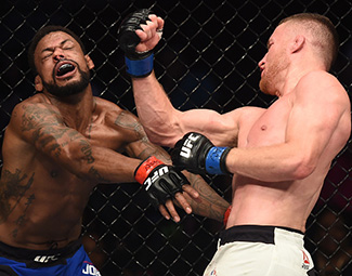 Justin Gaethje punches Michael Johnson during <a href='../event/The-Ultimate-Fighter-T-Rampage-vs-T-Forrest-Finale'><a href='../event/The-Ultimate-Fighter-Finale-Team-Nog-vs-Team-Mir'><a href='../event/The-Ultimate-Fighter-Team-Liddell-vs-Team-Ortiz-FINALE'><a href='../event/TUF13-finale'><a href='../event/the-ultimate-fighter-a-champion-will-be-crowned'>The Ultimate Fighter Finale </a></a></a></a></a>at T-Mobile Arena on July 7, 2017 in Las Vegas, Nevada. (Photo by Brandon Magnus/Zuffa LLC)
