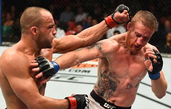 (L-R) <a href='../fighter/eddie-alvarez'>Eddie Alvarez</a> punches <a href='../fighter/Justin-Gaethje'>Justin Gaethje</a> in their lightweight bout during the UFC 218 event inside Little Caesars Arena on December 02, 2017 in Detroit, Michigan. (Photo by Josh Hedges/Zuffa LLC)