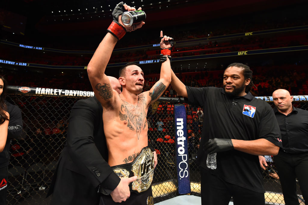 <a href='../fighter/Max-Holloway'>Max Holloway</a> celebrates his victory over <a href='../fighter/Jose-Aldo'>Jose Aldo</a> in their rematch fight at UFC 218