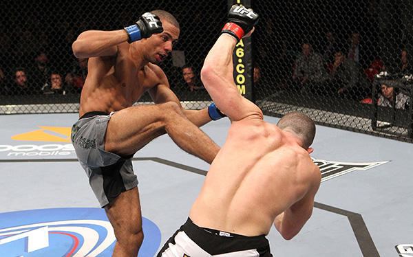 Edson Barboza lands a kick to the stomach against Mike Lullo during their Lightweight bout part of UFC 123 at the Palace of Auburn Hills on November 20, 2010 in Auburn Hills, Michigan. (Photo by Josh Hedges/Zuffa LLC)