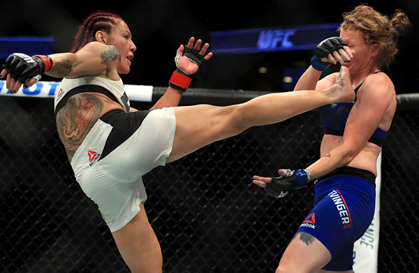 Cris Cyborg of Brazil (L) fights <a href='../fighter/Tonya-Evinger'>Tonya Evinger</a> during their Featherweight Title fight at UFC 214 at Honda Center on July 29, 2017 in Anaheim, California. (Photo by Sean M. Haffey/Getty Images)