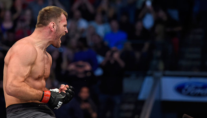 Stipe Miocic celebrates his TKO victory over Junior Dos Santos in their heavyweight bout at UFC 211 (Photo by Josh Hedges/Zuffa LLC via Getty Images)