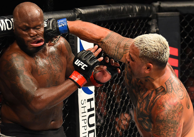 <a href='../fighter/mark-hunt'>Mark Hunt</a> punches <a href='../fighter/Derrick-Lewis'>Derrick Lewis</a> during the <a href='../event/UFC-Silva-vs-Irvin'>UFC Fight Night </a>event in Auckland, New Zealand. (Photo by Josh Hedges/Zuffa LLC)