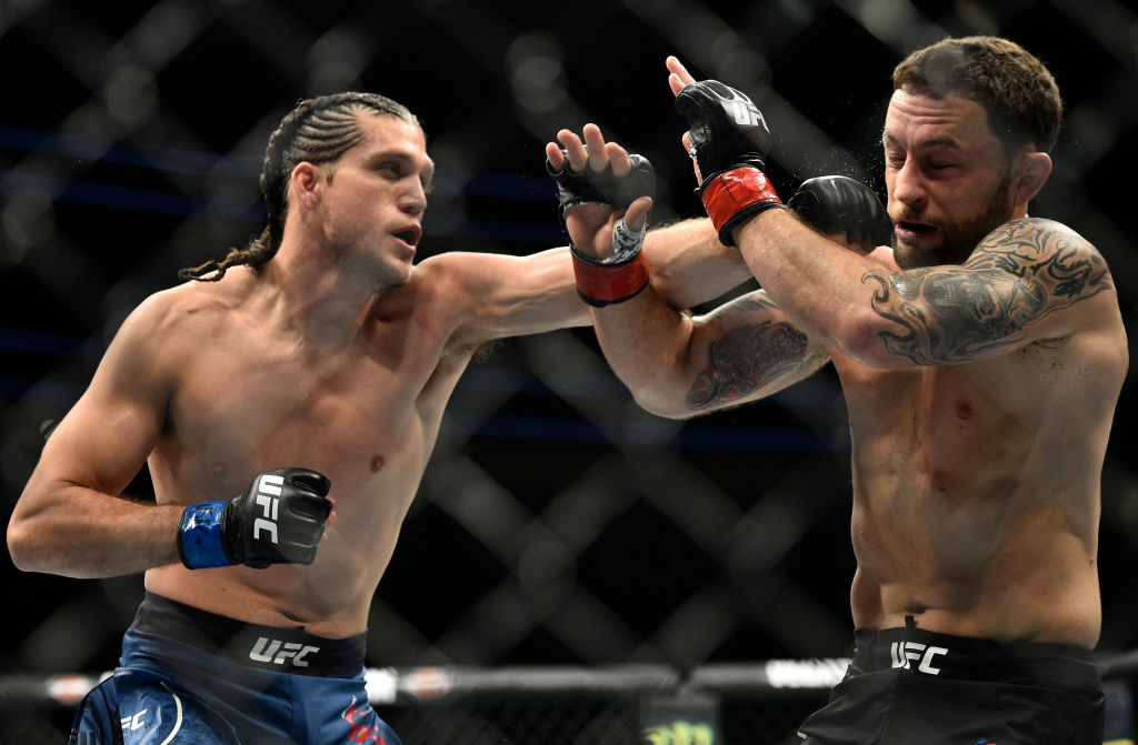 Brian Ortega punches <a href='../fighter/Frankie-Edgar'>Frankie Edgar</a> during UFC 222 on March 3, 2018. (Photo by Brandon Magnus/Zuffa LLC)