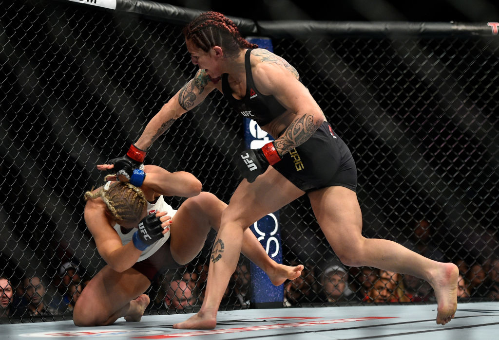 Cris Cyborg punches <a href='../fighter/Yana-Kunitskaya'>Yana Kunitskaya</a> during UFC 222 on March 3, 2018 in Las Vegas, NV. (Photo by Brandon Magnus/Zuffa LLC)