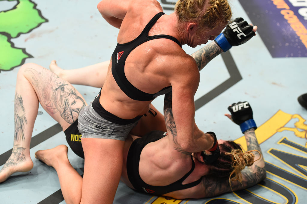 Holly Holm punches <a href='../fighter/megan-anderson'>Megan Anderson</a> at UFC 225 (Photo by Josh Hedges/Zuffa LLC)