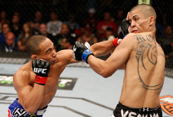 Dodson punches Moraga in their fight during the UFC Fight Night on June 7, 2014 in Albuquerque, NM. (Photo by Josh Hedges/Zuffa LLC)
