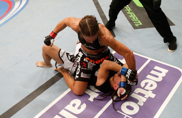 Carmouche attacks Andrade from the mount Carmouche attacks Andrade from the mount