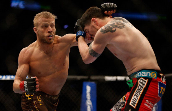 Ring throws a left at Camozzi Ring throws a left at Camozzi