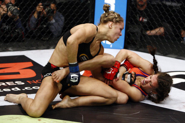Tate attempts to armbar Rousey Tate attempts to armbar Rousey