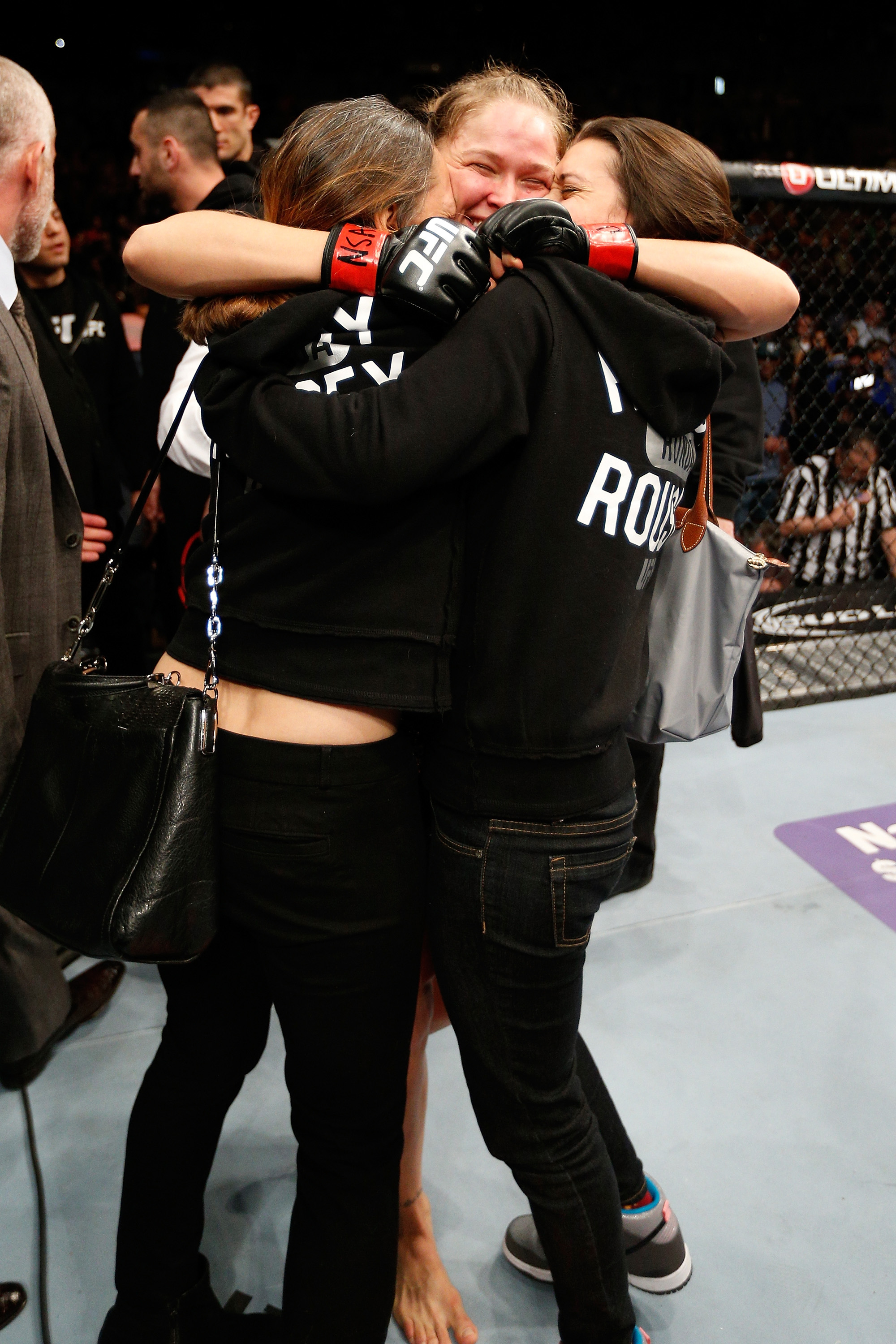 Rousey embraces her family