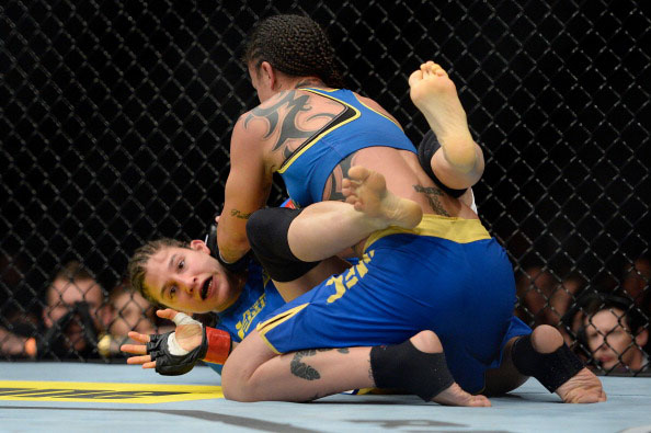 Pennington tries to pin Modafferi Pennington tries to pin Modafferi