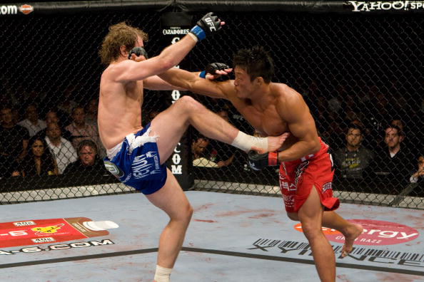 Akiyama lands a left against Belcher Akiyama lands a left against Belcher