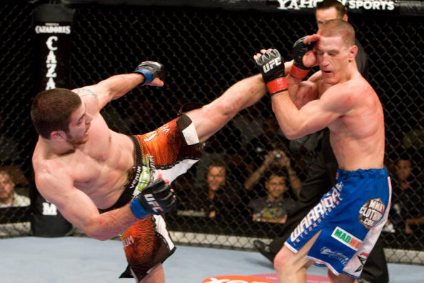 Miller unleashes a head kick Miller unleashes a head kick