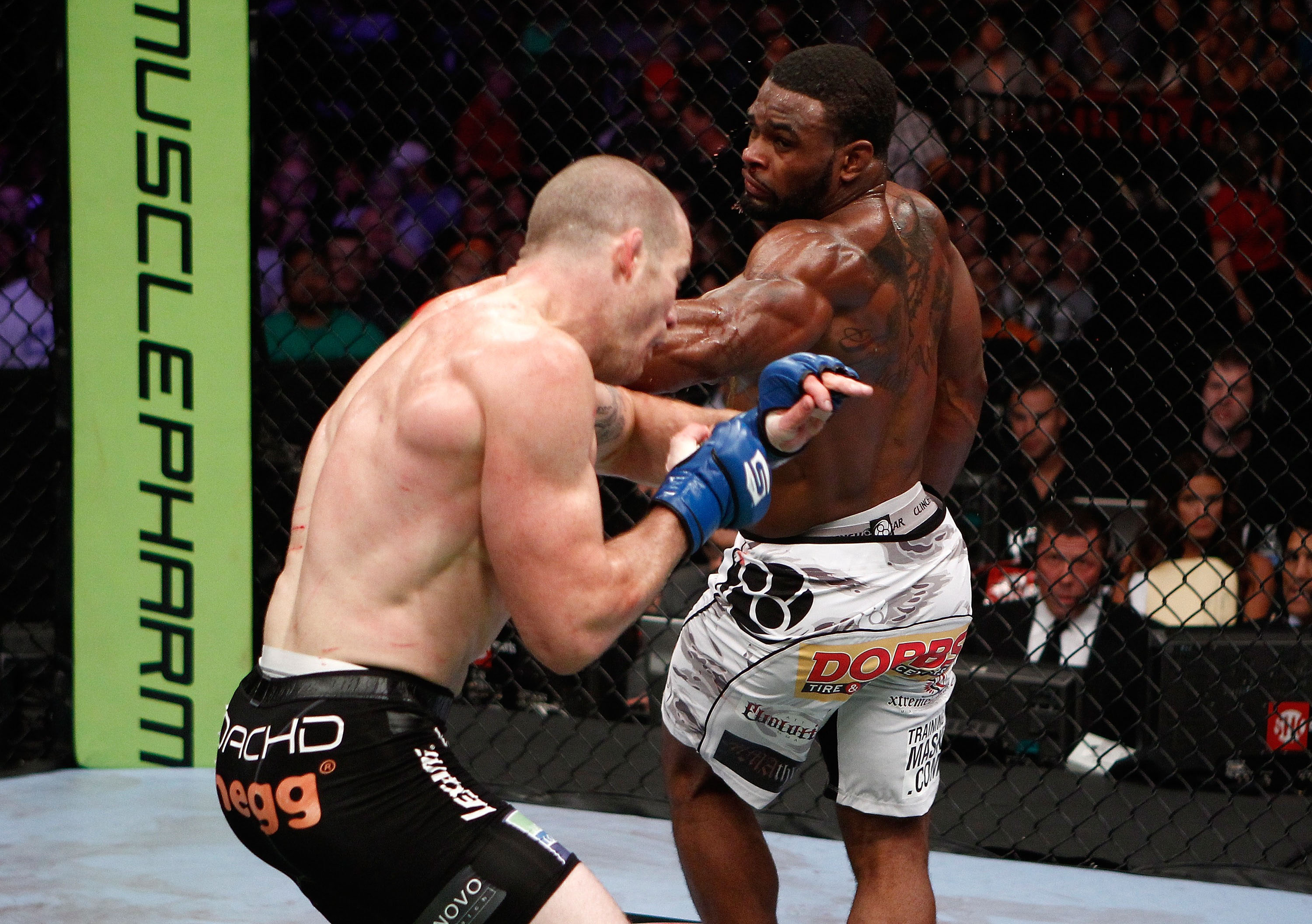 Woodley lands a spinning back fist Woodley lands a spinning back fist