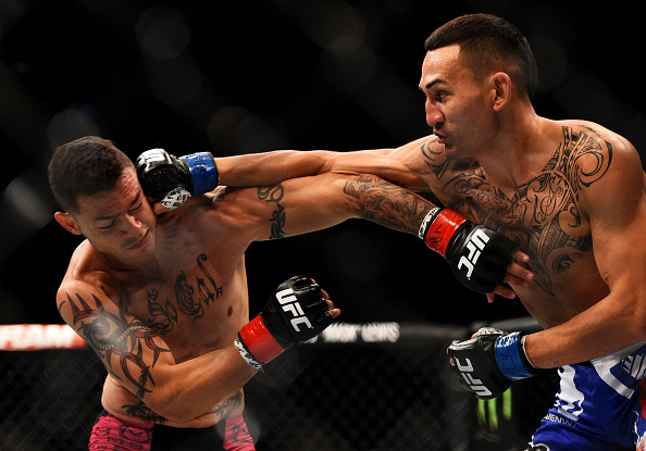 NEWARK, NJ - APRIL 18: Max Holloway (R) punches Cub Swanson in their featherweight bout during the UFC Fight Night event at Prudential Center on April 18, 2015 in Newark, New Jersey. (Photo by Jeff Bottari/Zuffa LLC/Zuffa LLC via Getty Images)
