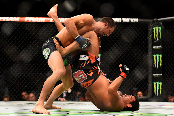 NEWARK, NJ - APRIL 18: Luke Rockhold and Lyoto Machida of Brazil grapple in their middleweight bout during the UFC Fight Night event at Prudential Center on April 18, 2015 in Newark, New Jersey. (Photo by Jeff Bottari/Zuffa LLC/Zuffa LLC via Getty Images)