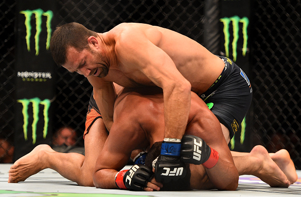 NEWARK, NJ - APRIL 18: Luke Rockhold and Lyoto Machida of Brazil grapple in their middleweight bout during the UFC Fight Night event at Prudential Center on April 18, 2015 in Newark, New Jersey. (Photo by Jeff Bottari/Zuffa LLC/Zuffa LLC via Getty Images)