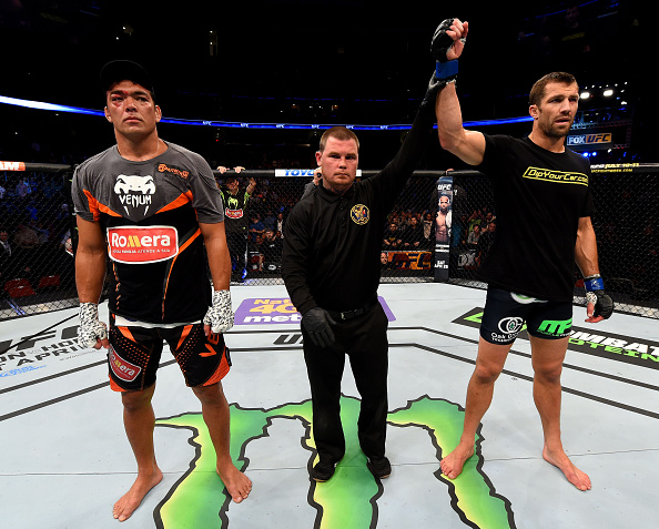 NEWARK, NJ - APRIL 18: Luke Rockhold celebrates defeating Lyoto Machida (L) of Brazil by tap out in their middleweight bout during the UFC Fight Night event at Prudential Center on April 18, 2015 in Newark, New Jersey. (Photo by Josh Hedges/Zuffa LLC/Zuffa LLC via Getty Images)