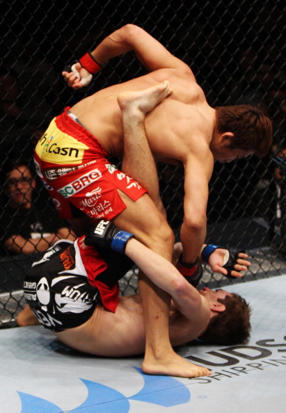 Dong Hyun Kim unleashes punches on <a href='../fighter/John-Hathaway'>John Hathaway</a> in their welterweight fight during the UFC Fight Night event at the Venetian Macau on March 1, 2014 in Macau. (Photo by Mitch Viquez/Zuffa LLC)