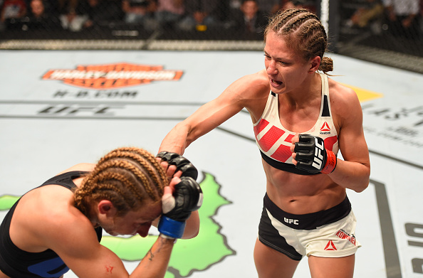 (R-L) Karolina Kowalkiewicz punches <a href='../fighter/Heather-Clark'><a href='../fighter/Heather-Clark'>Heather Jo Clark</a></a> in their women's strawweight bout during the UFC Fight Night event at Ahoy Rotterdam on May 8, 2016 in Rotterdam, Netherlands. (Photo by Josh Hedges/Zuffa LLC)