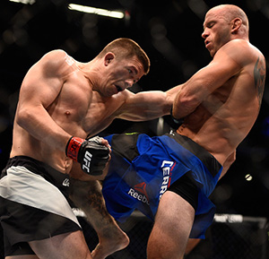 Donald Cerrone lands a knee to the body of <a href='../fighter/Rick-Story'>Rick Story</a> in their welterweight bout during the UFC 202 event at T-Mobile Arena on August 20, 2016 in Las Vegas, NV. (Photo by Jeff Bottari/Zuffa LLC/)