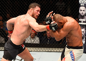 Michael Bisping punches <a href='../fighter/Dan-Henderson'>Dan Henderson</a> in their bout during the UFC 204 in Manchester, England. (Photo by Josh Hedges/Zuffa LLC)