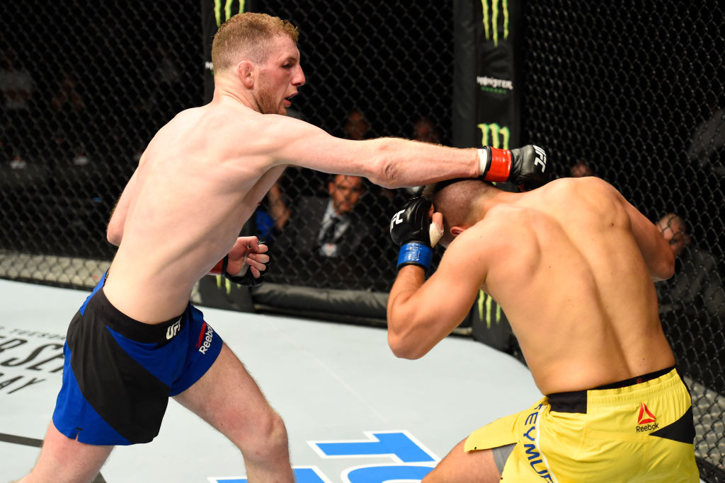 GLASGOW, SCOTLAND - (L-R) Danny Henry of Scotland punches Daniel Teymur of Sweden in their lightweight bout during the UFC Fight Night event at the SSE Hydro Arena Glasgow on July 16, 2017 in Glasgow, Scotland. (Photo by Josh Hedges/Zuffa LLC)