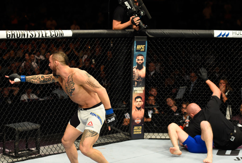 GLASGOW, SCOTLAND - (L-R) <a href='../fighter/santiago-ponzinibbio'>Santiago Ponzinibbio</a> of Argentina celebrates his victory over <a href='../fighter/Gunnar-Nelson'>Gunnar Nelson</a> of Iceland in their welterweight bout during the <a href='../event/UFC-Silva-vs-Irvin'>UFC Fight Night </a>event at the SSE Hydro Arena Glasgow on July 16, 2017 in Glasgow, Scotland. (Photo by Josh Hedges/Zuffa LLC)