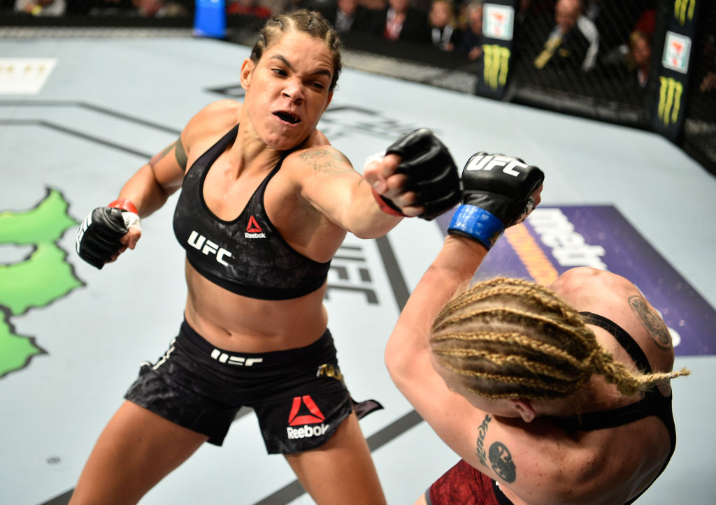 EDMONTON, AB - SEPTEMBER 09: (L-R) <a href='../fighter/Amanda-Nunes'>Amanda Nunes</a> of Brazil punches <a href='../fighter/Valentina-Shevchenko'>Valentina Shevchenko</a> of Kyrgyzstan in their women's bantamweight bout during the UFC 215 event inside the Rogers Place on September 9, 2017 in Edmonton, Alberta, Canada. (Photo by Jeff Bottari/Zuffa LLC)