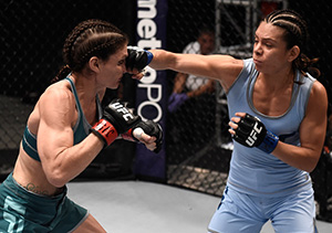 Nicco Montano punches <a href='../fighter/Lauren-Murphy'>Lauren Murphy</a> during the filming of The Ultimate Fighter: A New World Champion at the UFC TUF Gym on July 27, 2017 in Las Vegas, Nevada. (Photo by Brandon Magnus/Zuffa LLC)