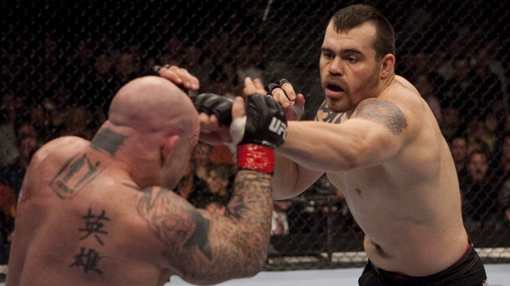 SACRAMENTO, CA - NOVEMBER 18: (R-L) Tim Sylvia punches Jeff Monson at UFC 65 at the Arco Arena on November 18, 2006 in Sacramento, California. (Photo by Josh Hedges/Zuffa LLC)