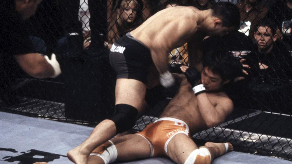 LAS VEGAS, NV - NOVEMBER 02: (L-R) BJ Penn knocks out Caol Uno during their lightweight fight at UFC 34 inside MGM Grand Garden Arena on November 2, 2001 in Las Vegas, Nevada. (Photo by Zuffa LLC)