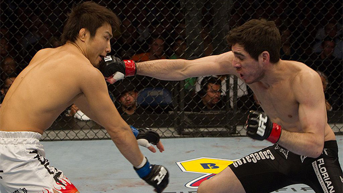 CHARLOTTE, NC - MARCH 31: Kenny Florian (black shorts) def. Takanori Gomi (white/flame shorts) - Submission (rear naked choke) - 2:52 round 3 during UFC Fight Night 21 at Bojangles Coliseum on March 31, 2010 in Charlotte, North Carolina. (Photo by Josh Hedges/Zuffa LLC)