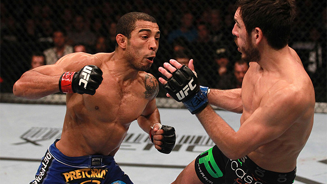 HOUSTON, TX - OCTOBER 08: (L-R) Jose Aldo punches Kenny Florian during the UFC 136 event at Toyota Center on October 8, 2011 in Houston, Texas. (Photo by Nick Laham/Zuffa LLC)