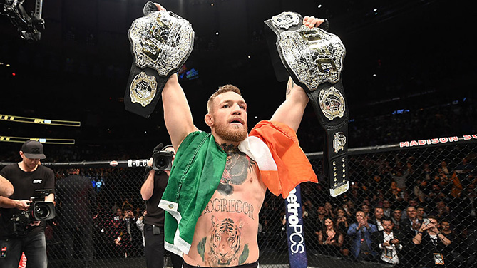 NEW YORK, NY - NOVEMBER 12: UFC lightweight and featherweight champion Conor McGregor of Ireland celebrates after defeating Eddie Alvarez in their UFC lightweight championship fight during the UFC 205 event at Madison Square Garden on November 12, 2016 in New York City. (Photo by Jeff Bottari/Zuffa LLC)
