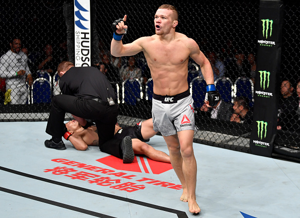 SINGAPORE - JUNE 23: <a href='../fighter/Petr-Yan'>Petr Yan</a> of Russia celebrates after his knockout victory over <a href='../fighter/teruto-ishihara'>Teruto Ishihara</a> of Japan in their bantamweight bout during the <a href='../event/UFC-Silva-vs-Irvin'>UFC Fight Night </a>event at the Singapore Indoor Stadium on June 23, 2018 in Singapore. (Photo by Jeff Bottari/Zuffa LLC/Zuffa LLC via Getty Images)