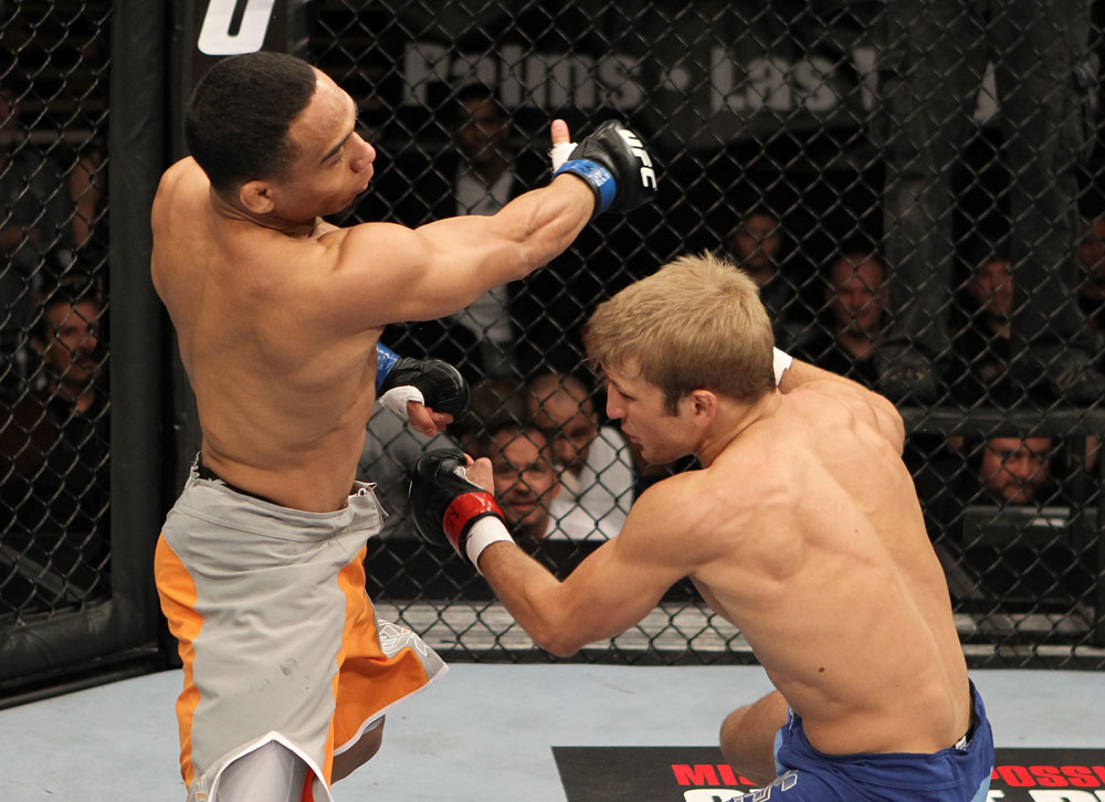 John Dodson follows up on a punch on TJ Dillashaw during The Ultimate Fighter 14 Finale on December 3, 2011 in Las Vegas, NV. (Photo by Josh Hedges/Zuffa LLC)