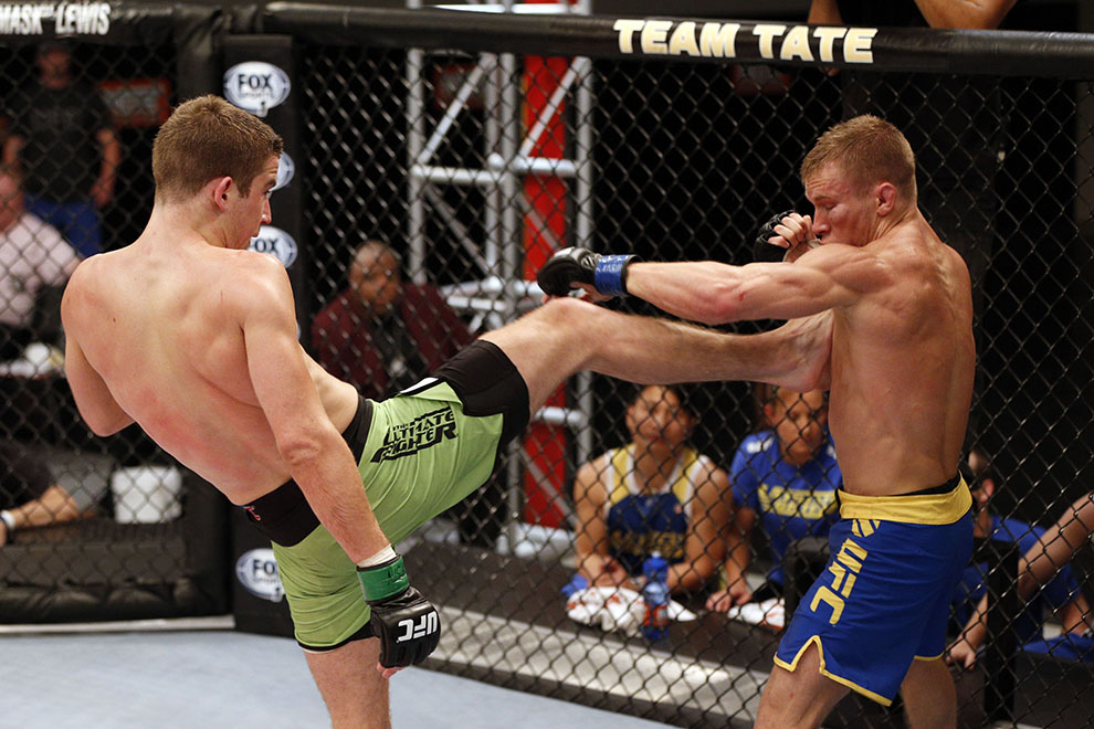 Wootten separates with a front kick Wootten separates with a front kick