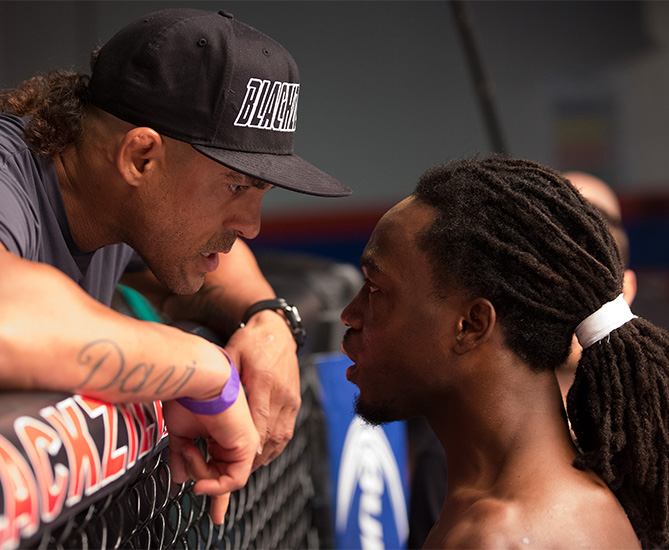 Jason Jackson talks to his teammate Vitor Belfort before facing Michael Graves during the filming of The Ultimate Fighter: American Top Team. (Photo by Chris Trotman/Zuffa LLC)