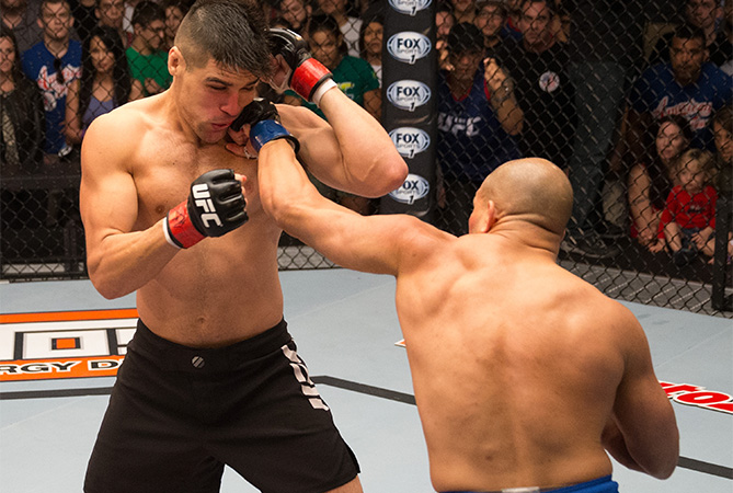 (R-L) Hayder Hassan punches Vicente Luque during the filming of The Ultimate Fighter: American Top Team vs Blackzilians on February 27, 2015 in Coconut Creek, Florida. (Photo by Chris Trotman/Zuffa LLC)