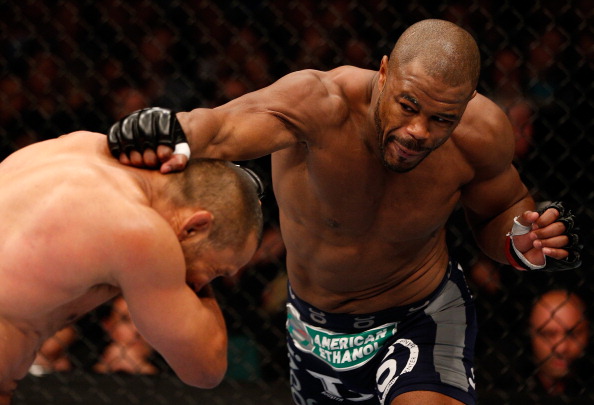 WINNIPEG, CANADA - JUNE 15: (R-L) Rashad Evans punches Dan Henderson in their light heavyweight fight during the UFC 161 event at the MTS Centre on June 15, 2013 in Winnipeg, Manitoba, Canada. (Photo by Josh Hedges/Zuffa LLC/Zuffa LLC via Getty Images)
