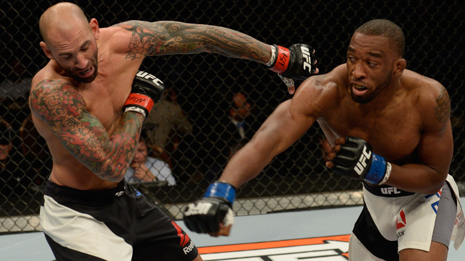 Dominic Waters punches George Sullivan in their welterweight bout during the Ultimate Fighter Finale inside MGM Grand Garden Arena on July 12, 2015 in Las Vegas, Nevada. (Photo by Brandon Magnus/Zuffa LLC)