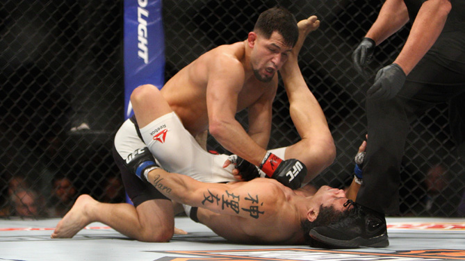 Jorge Masvidal (top) punches Cezar Ferreira in their welterweight bout during the Ultimate Fighter Finale inside MGM Grand Garden Arena on July 12, 2015 in Las Vegas, Nevada. (Photo by Mitch Viquez/Zuffa LLC)
