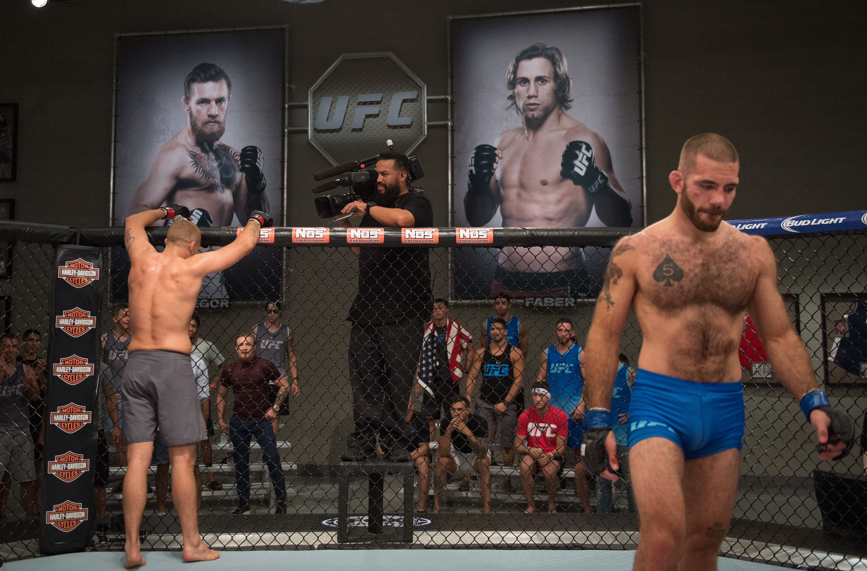 (L-R) Marcin Wrzosek raises his hands after his fight against Tom Gallicchio during the filming of The Ultimate Fighter: Team McGregor vs Team Faber at the UFC TUF Gym on July 30, 2015 in Las Vegas, Nevada. (Brandon Magnus/Zuffa LLC)