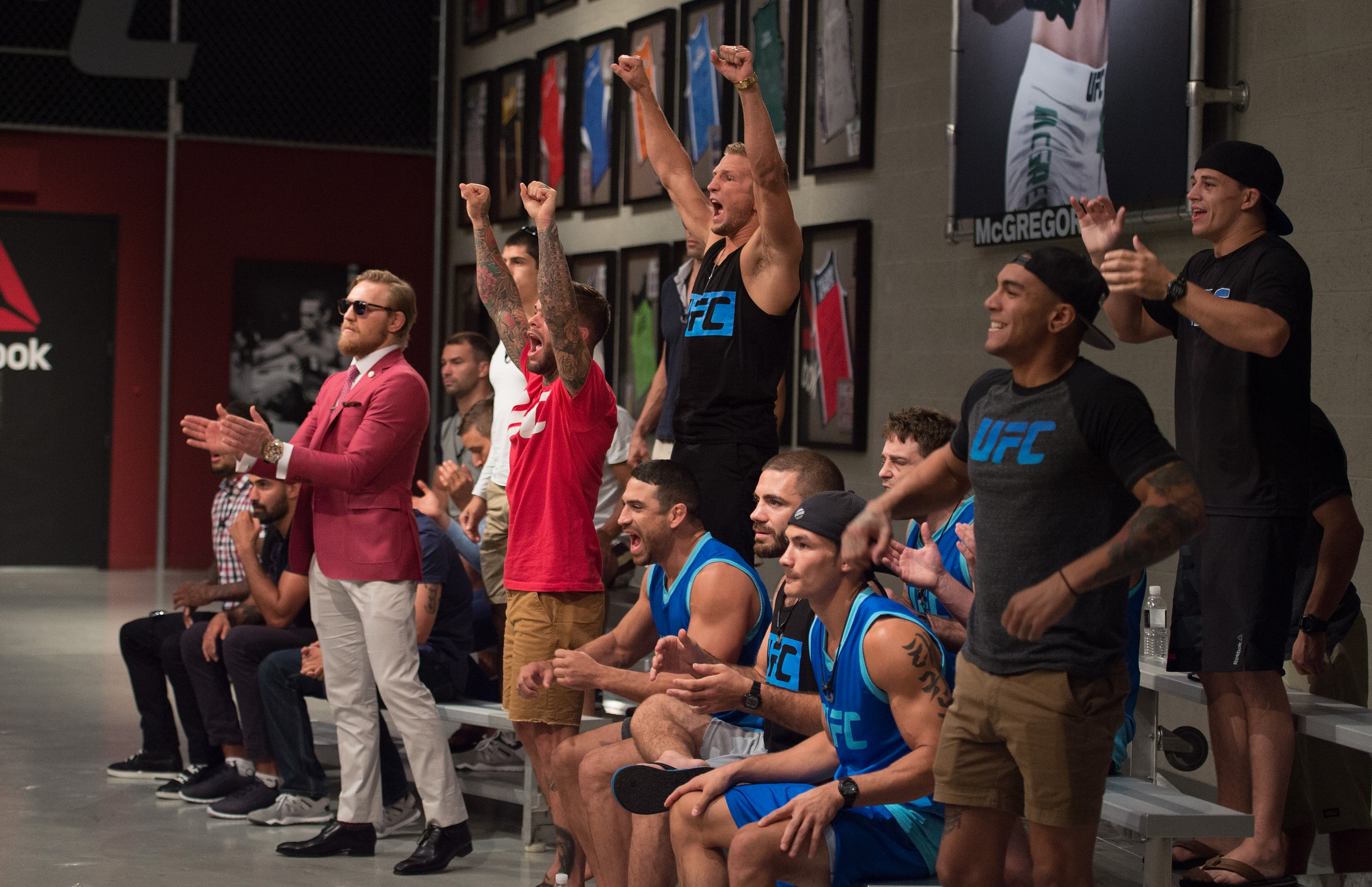 Team McGregor and Team Faber cheer as they watch Mehdi Baghdad face Julian Erosa during the filming of The Ultimate Fighter: Team McGregor vs Team Faber at the UFC TUF Gym on August 5, 2015 in Las Vegas, Nevada. (Photo by Elliot Howard/Zuffa LLC)