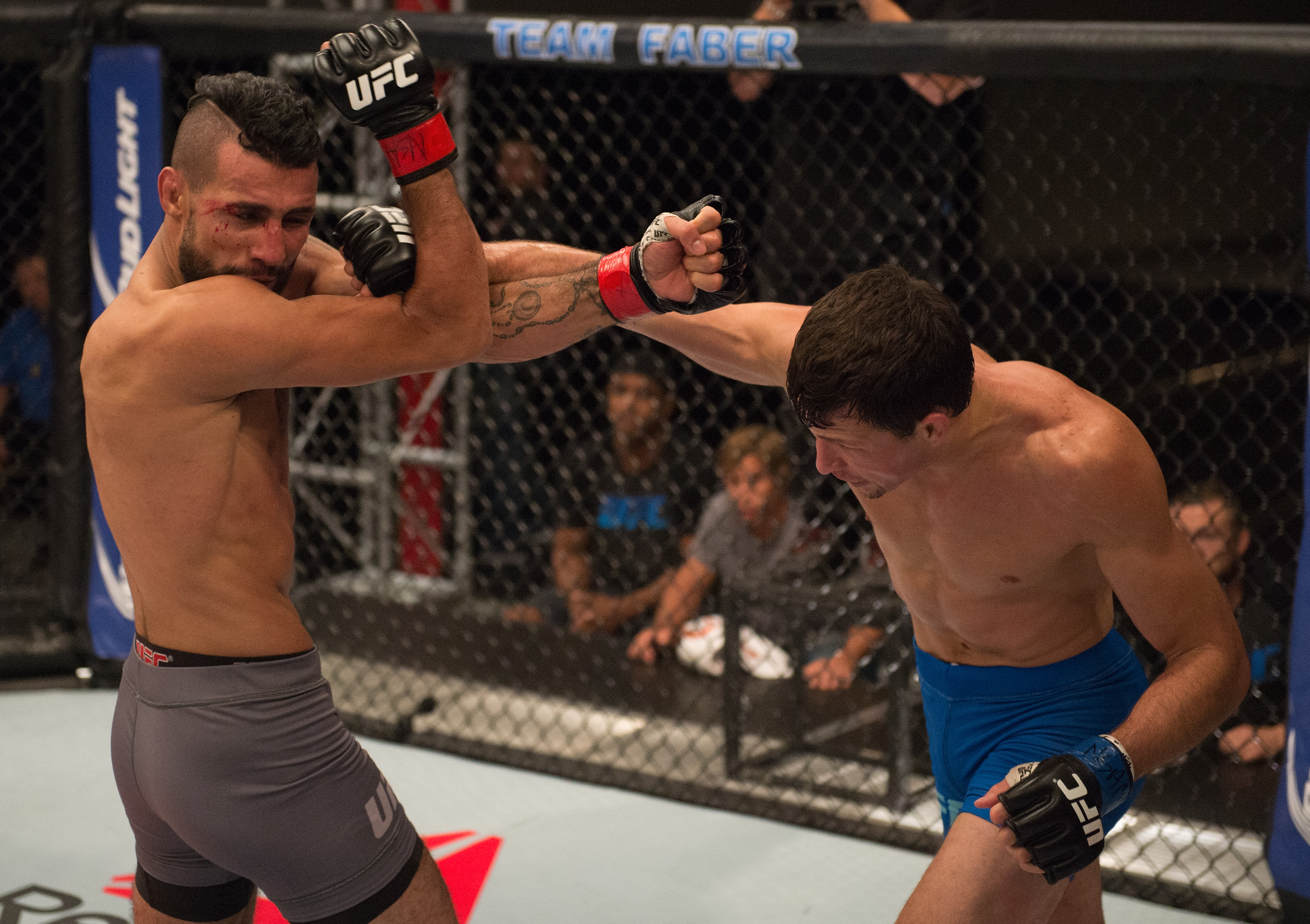 (R-L) Julian Erosa punches Mehdi Baghdad during the filming of The Ultimate Fighter: Team McGregor vs Team Faber at the UFC TUF Gym on August 5, 2015 in Las Vegas, Nevada. (Photo by Brandon Magnus/Zuffa LLC/Zuffa LLC)