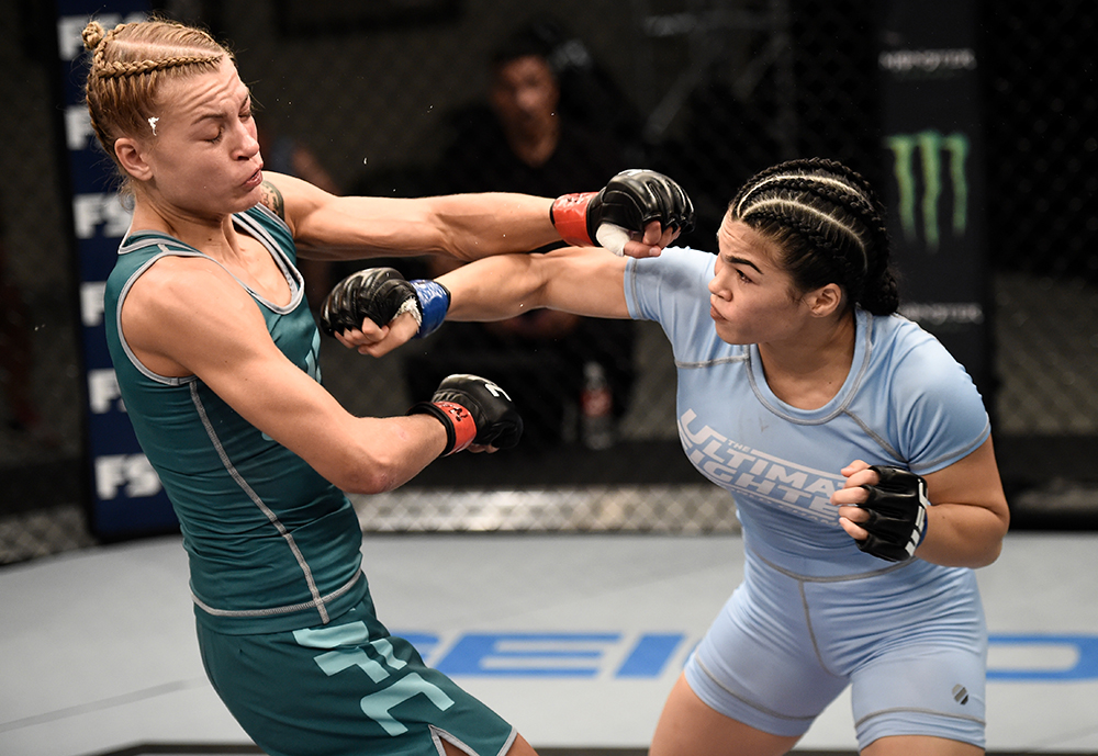 Rachael Ostovich-Berdon punches Melinda Fabian during their opening round fight in The Ultimate Fighter