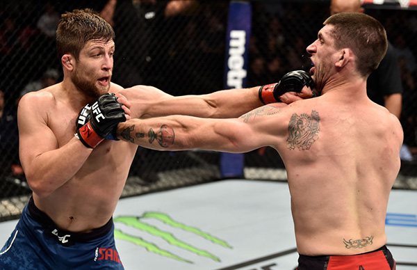 (L-R) Andrew Sanchez punches Ryan Janes of Canada in their middleweight bout during the TUF Finale event inside Park Theater on December 01, 2017 in Las Vegas, Nevada. (Photo by Jeff Bottari/Zuffa LLC)